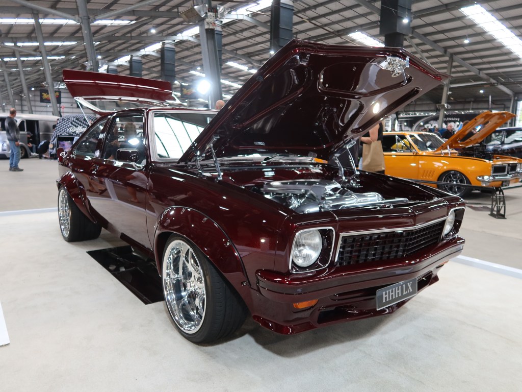 Flexing Muscle With The Triple H Torana